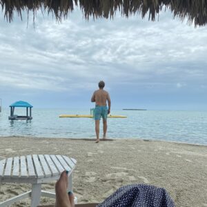 Logo of Virtuoso Family Travel with a family symbol.