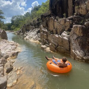 Logo of Virtuoso Family Travel with a family symbol.