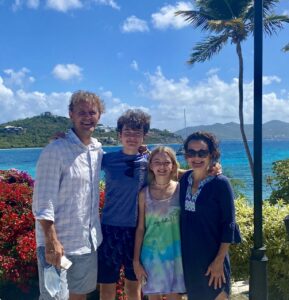 Logo of Virtuoso Family Travel with a family symbol.