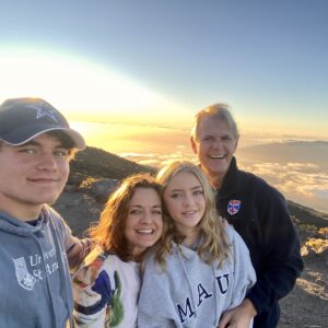 Logo of Virtuoso Family Travel with a family symbol.