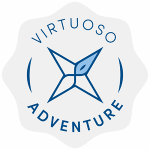 A blue compass rose logo with 'Virtuoso Adventure' text encircling it.